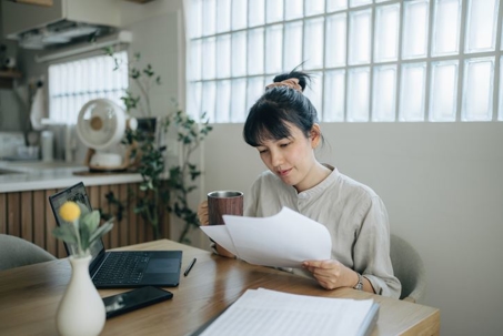 woman reviewing property value documents